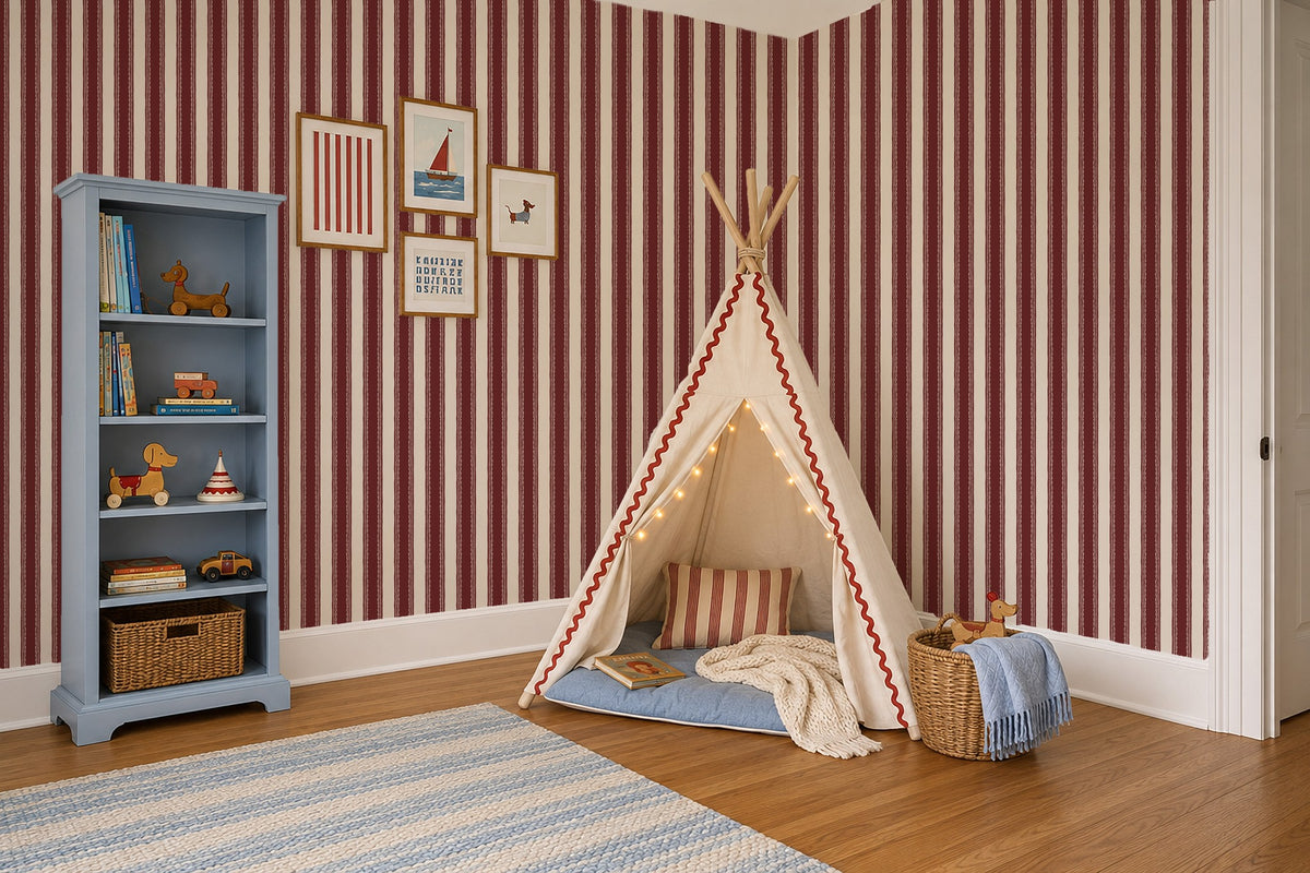Red and cream striped wallpaper in a cozy children's room with a play tent.