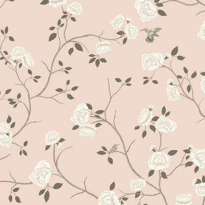 Pink wallpaper with ivory roses, sage leaves, and hummingbirds in a vintage floral design.