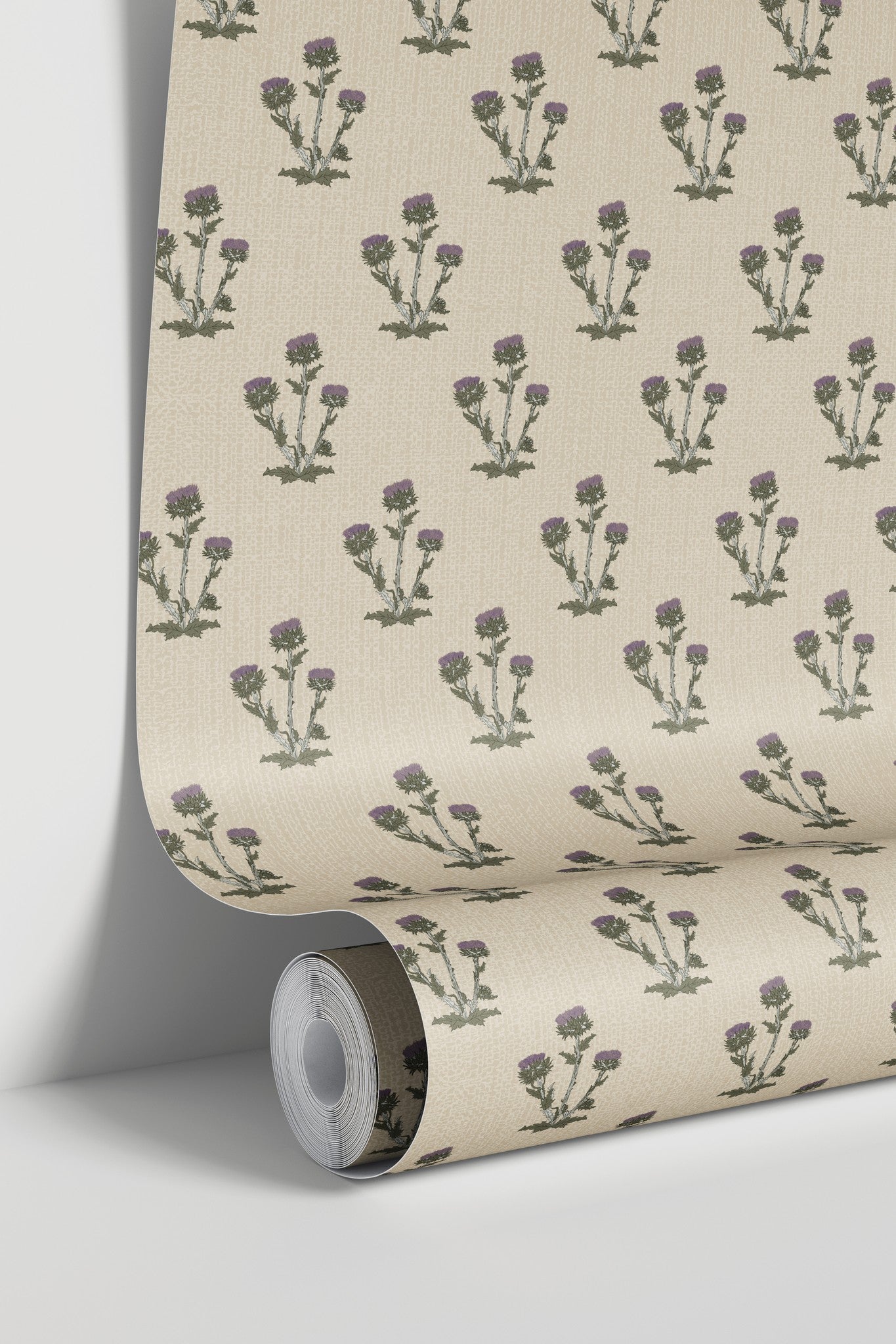 Tan wallpaper with lavender thistle pattern on textured cream background.