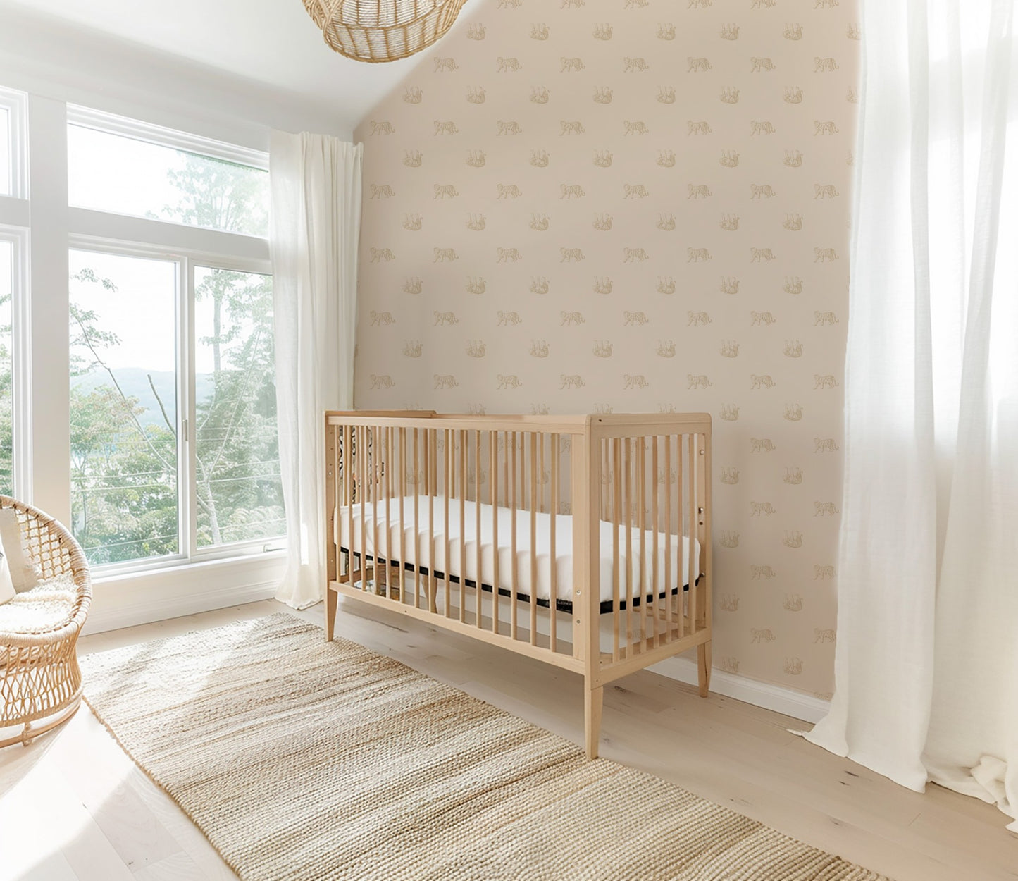 Tiger cream wallpaper in a bright nursery with a wooden crib and wicker chair.