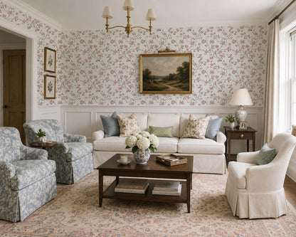 Living room with white rose floral wallpaper, vintage decor, and cozy seating.